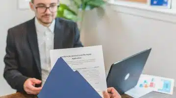 A Person Holding Loan Documents